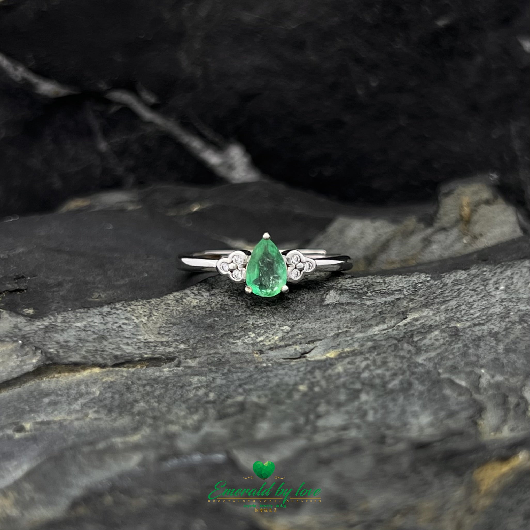 Ring with Central Teardrop Emerald and Zircon Flower Accents