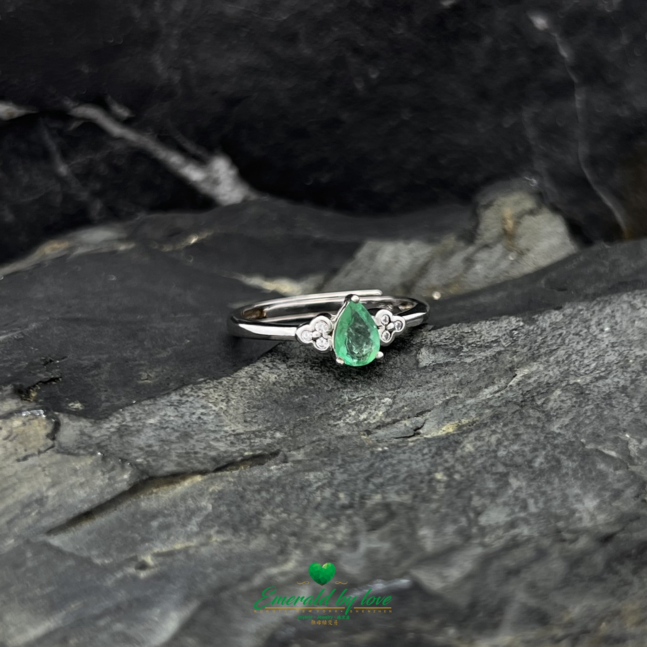 Ring with Central Teardrop Emerald and Zircon Flower Accents