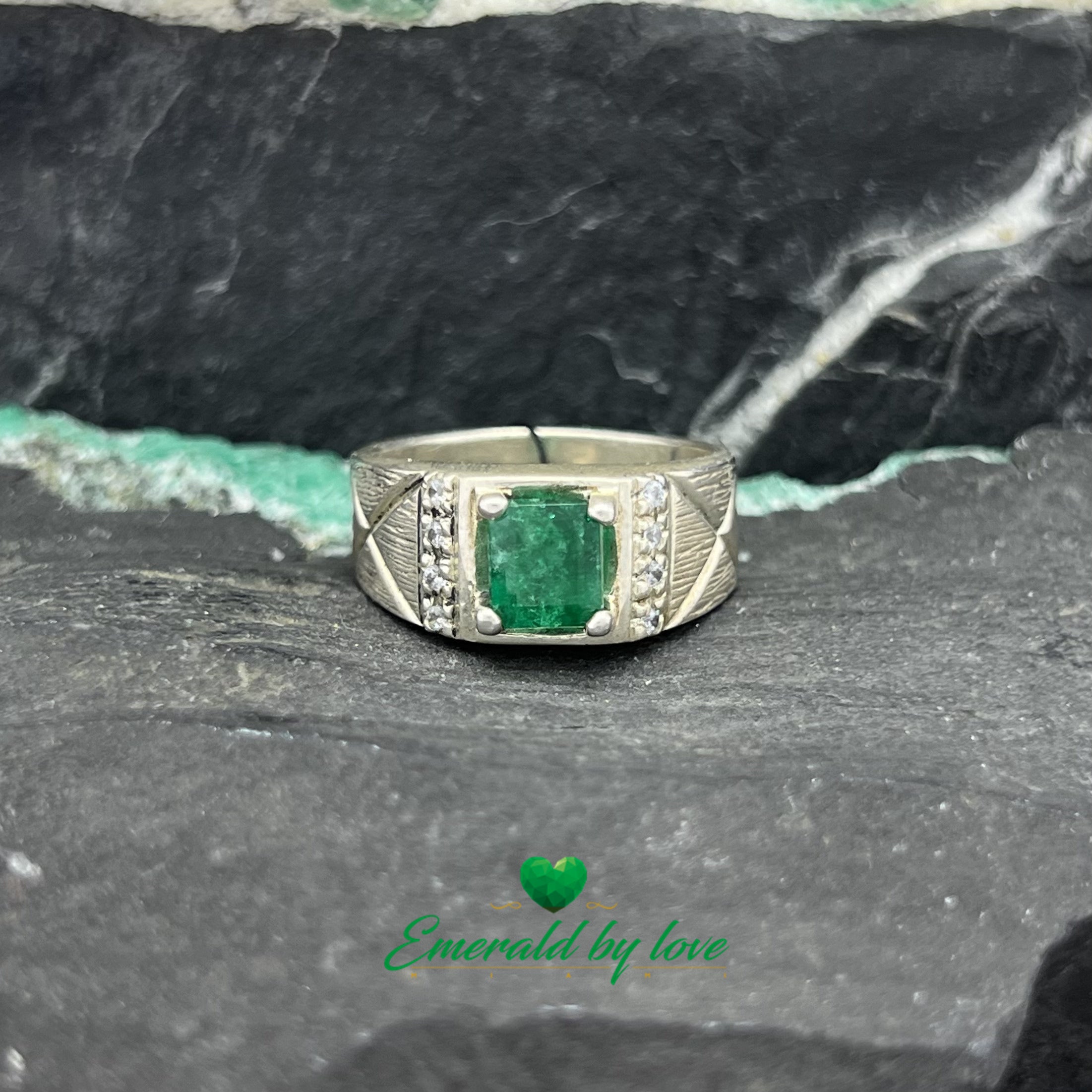 Elegant Silver Ring with Rectangular Emerald and Decorative Zircon Lines