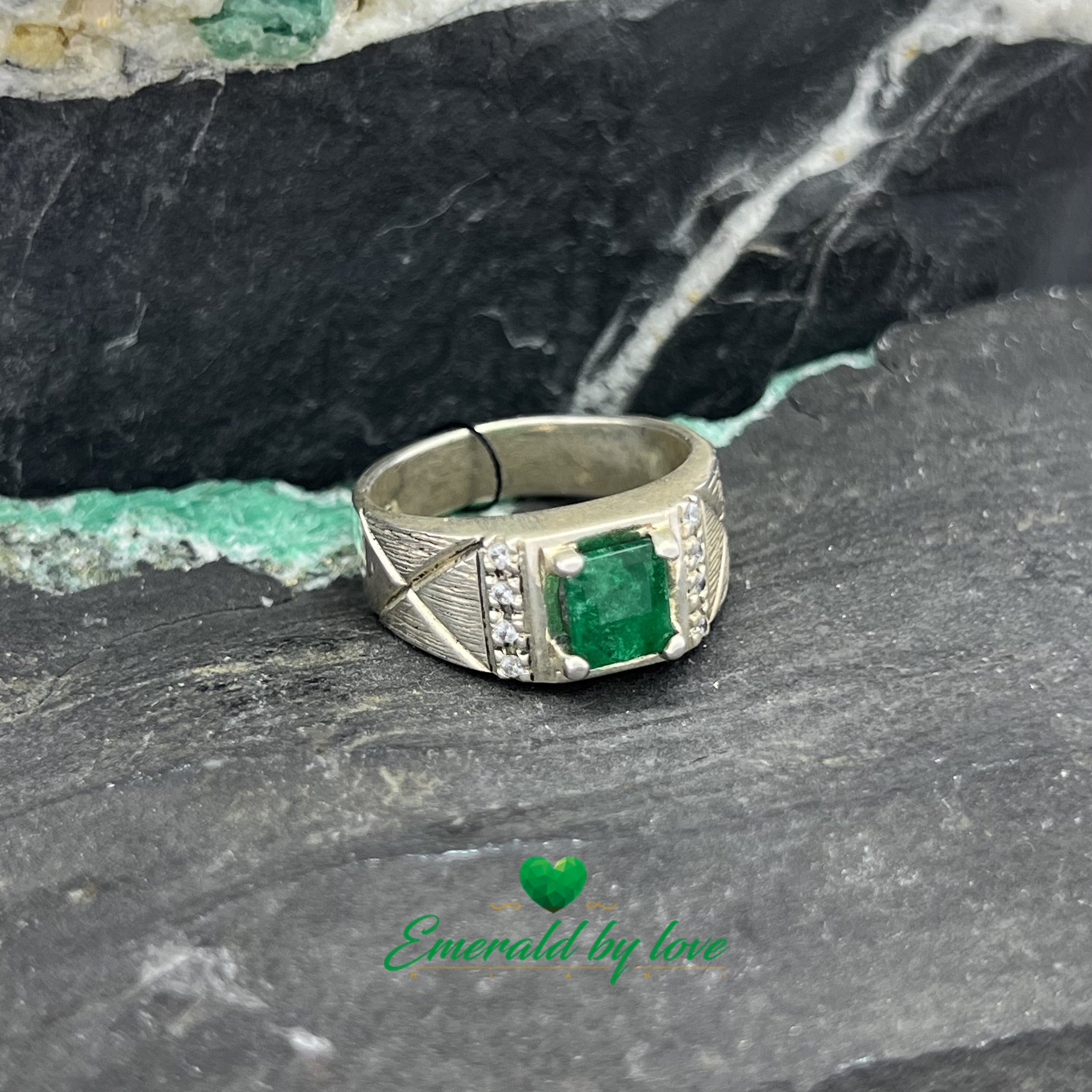 Elegant Silver Ring with Rectangular Emerald and Decorative Zircon Lines