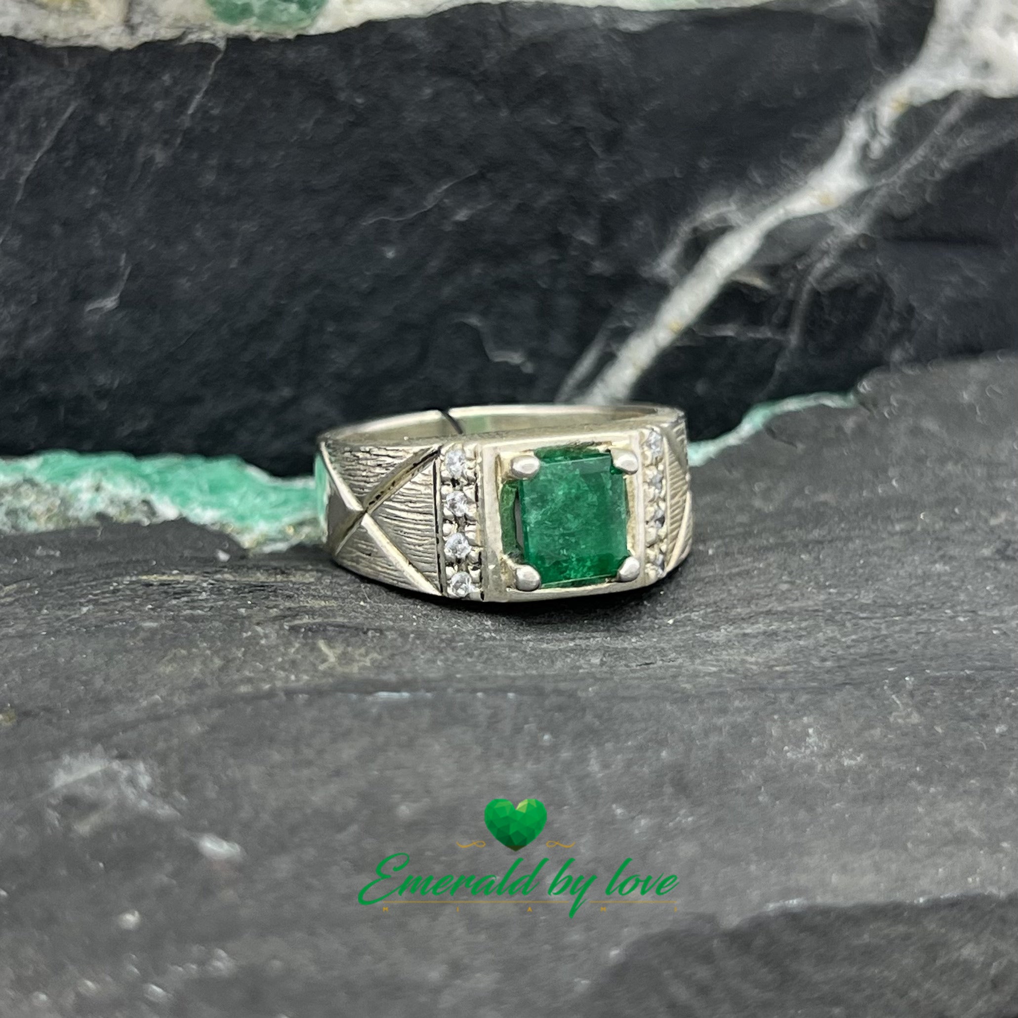 Elegant Silver Ring with Rectangular Emerald and Decorative Zircon Lines