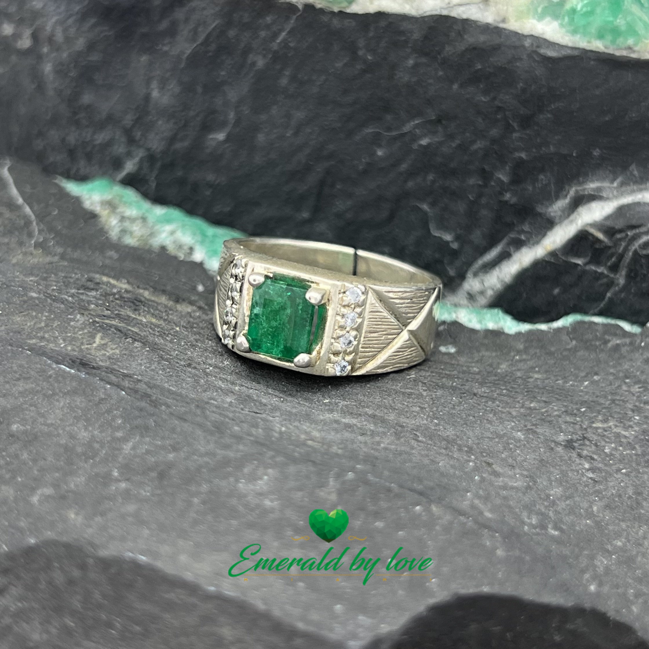 Elegant Silver Ring with Rectangular Emerald and Decorative Zircon Lines