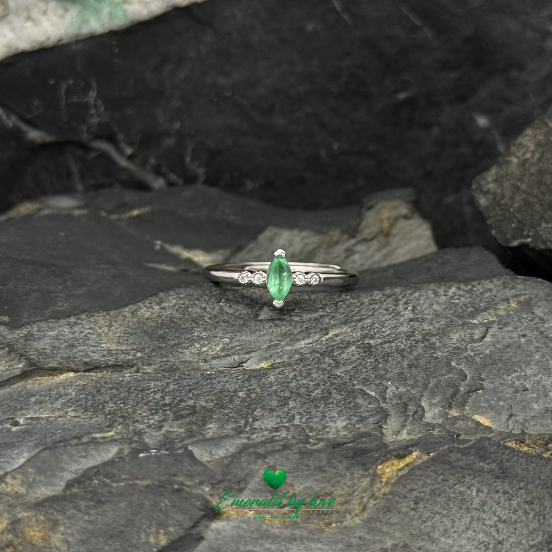 Sterling Silver Solitaire Ring with Marquise-Cut Emerald and Cubic Zirconia Band