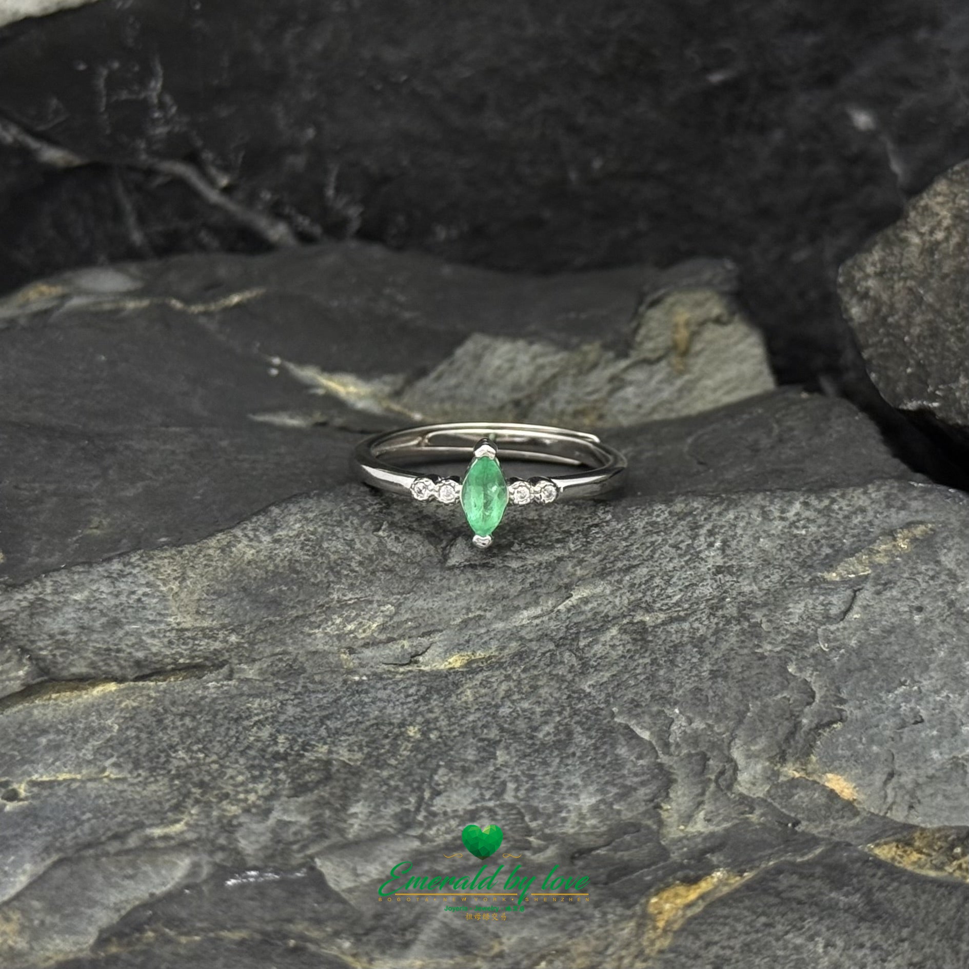 Sterling Silver Solitaire Ring with Marquise-Cut Emerald and Cubic Zirconia Band