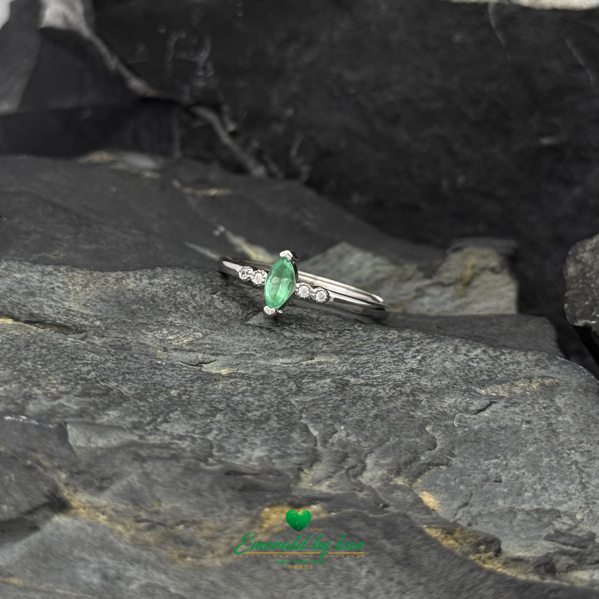 Sterling Silver Solitaire Ring with Marquise-Cut Emerald and Cubic Zirconia Band