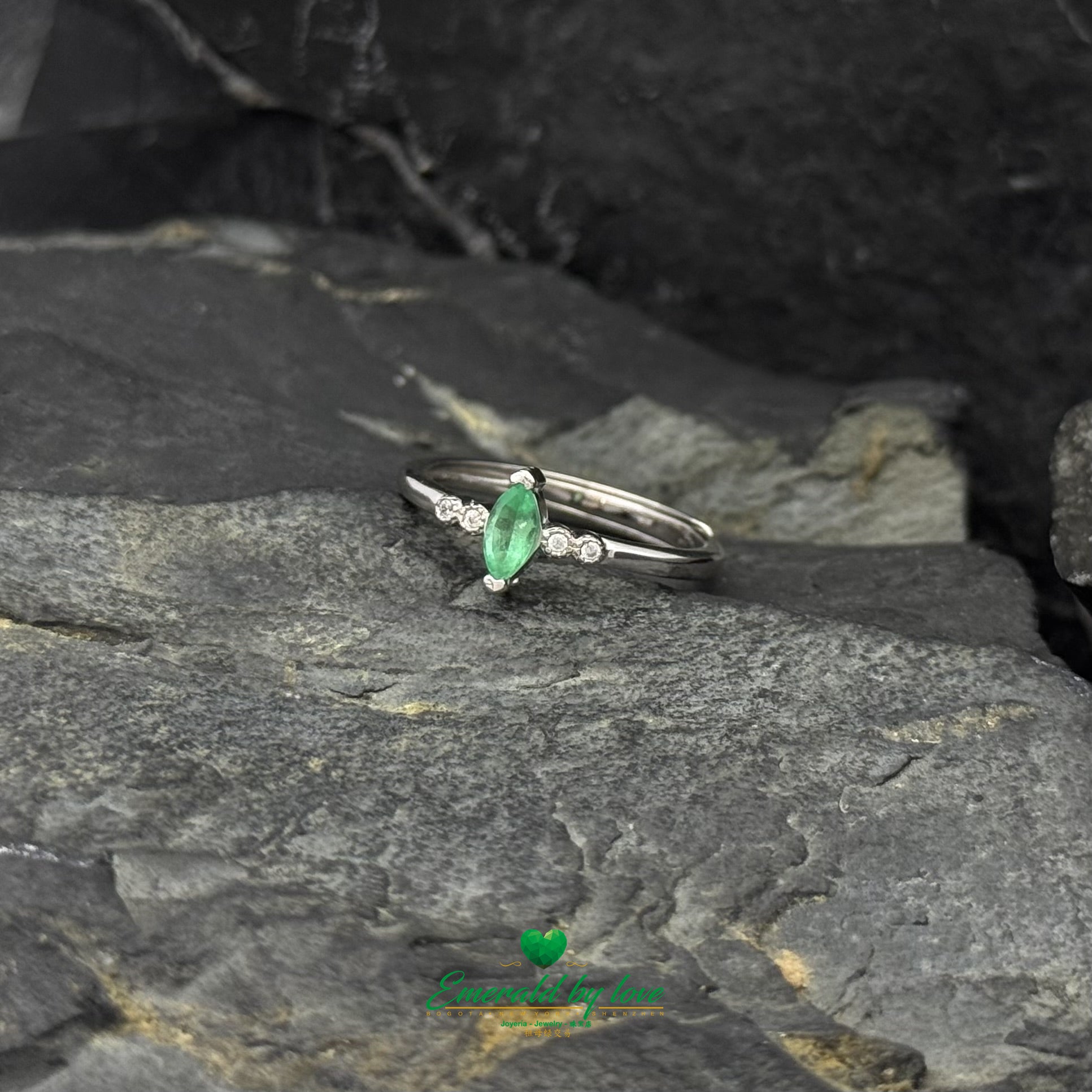 Sterling Silver Solitaire Ring with Marquise-Cut Emerald and Cubic Zirconia Band