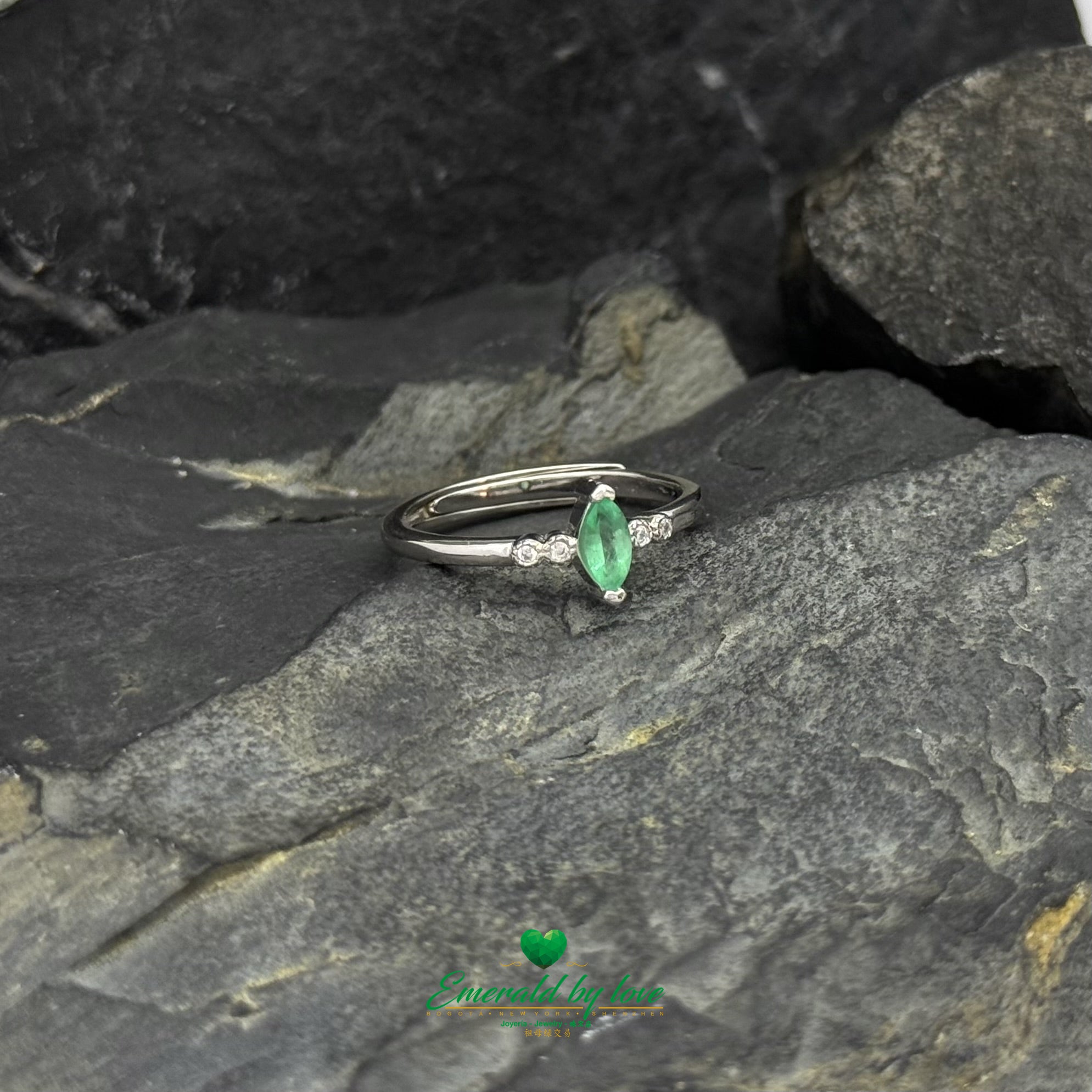 Sterling Silver Solitaire Ring with Marquise-Cut Emerald and Cubic Zirconia Band