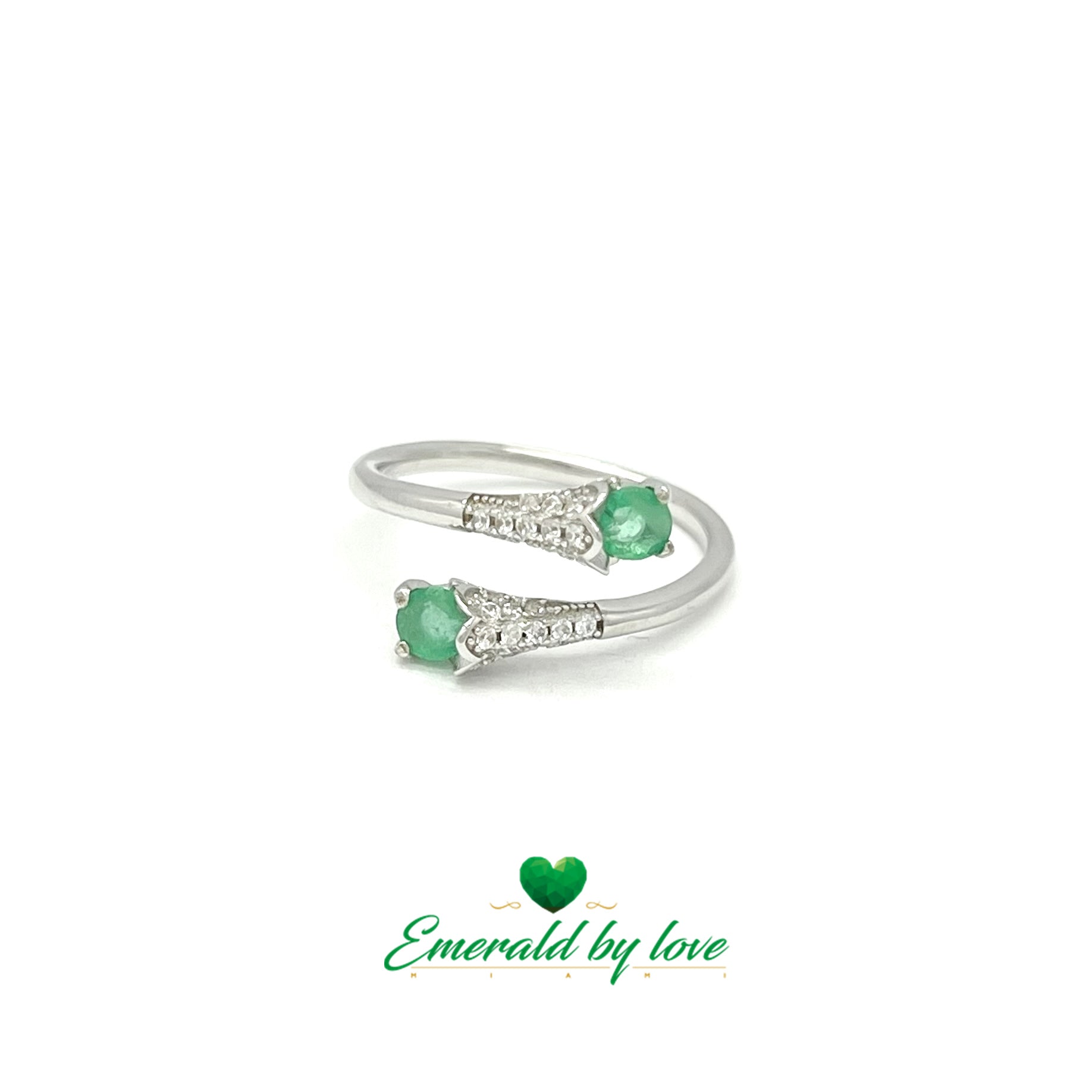 Elegant Silver Ring with Emeralds and Intricate Arabesque Design