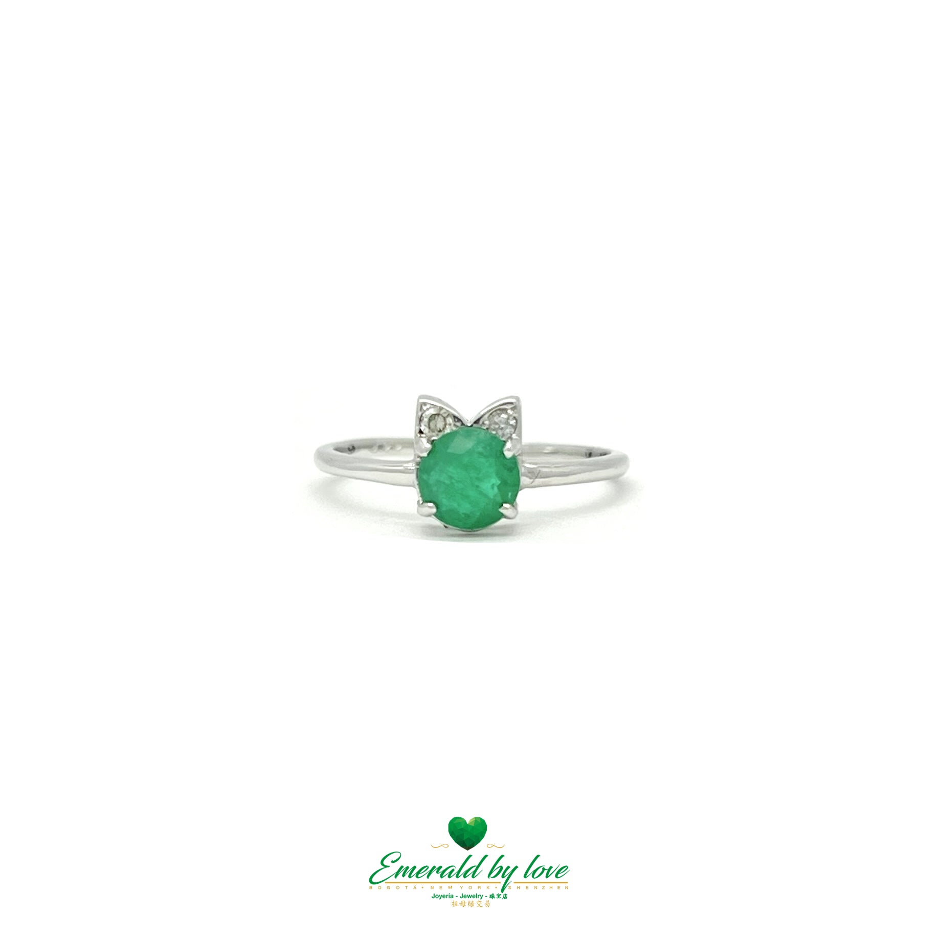 design in polished 18k gold with a single Colombian emerald.