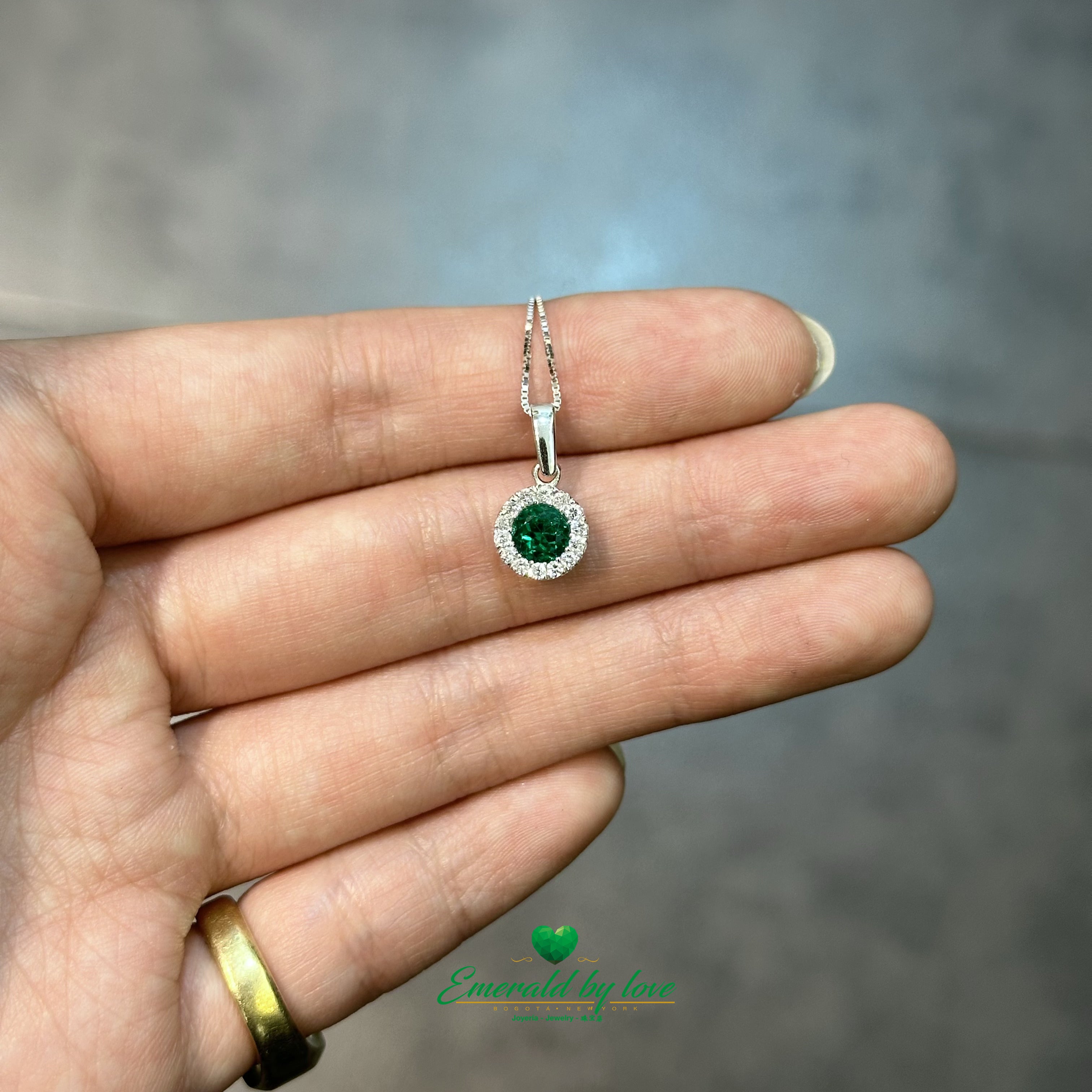 White Gold Ring, Earrings, and Pendant Set with High-Quality Round Emeralds and Diamond Accents