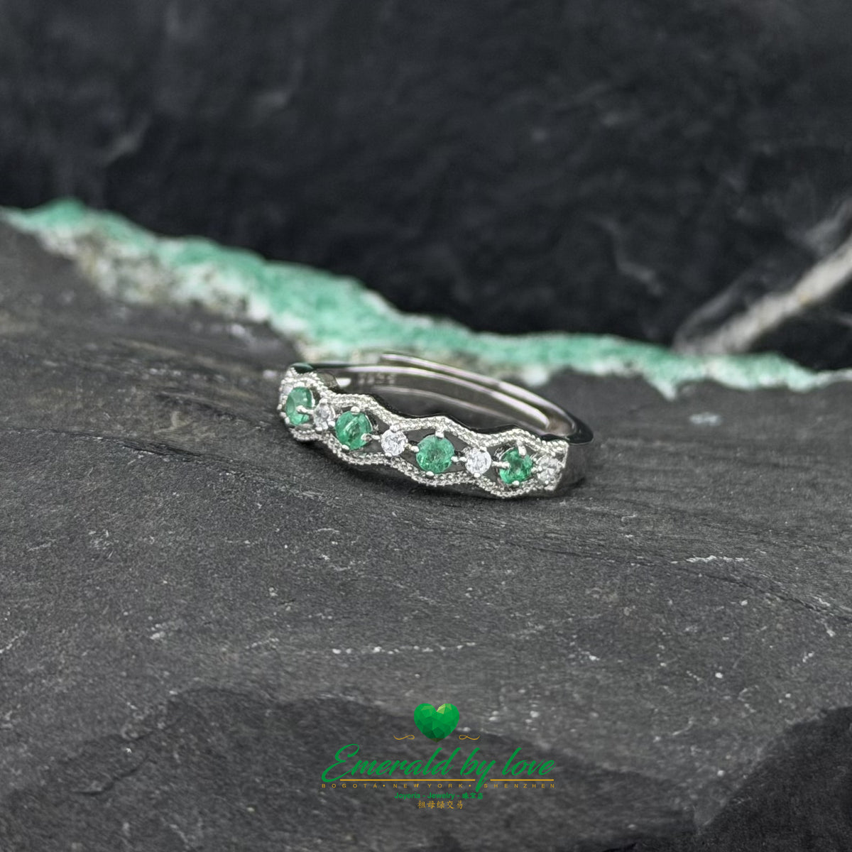Silver Ring Featuring Alternating Zircons and Ornamental Details