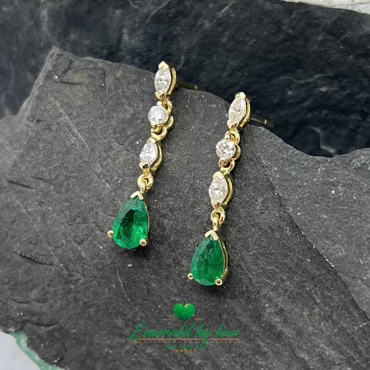 Gilded Harmony: 18K Yellow Gold Earrings with 1.35 TCW Pear-shaped Emeralds - Diamonds