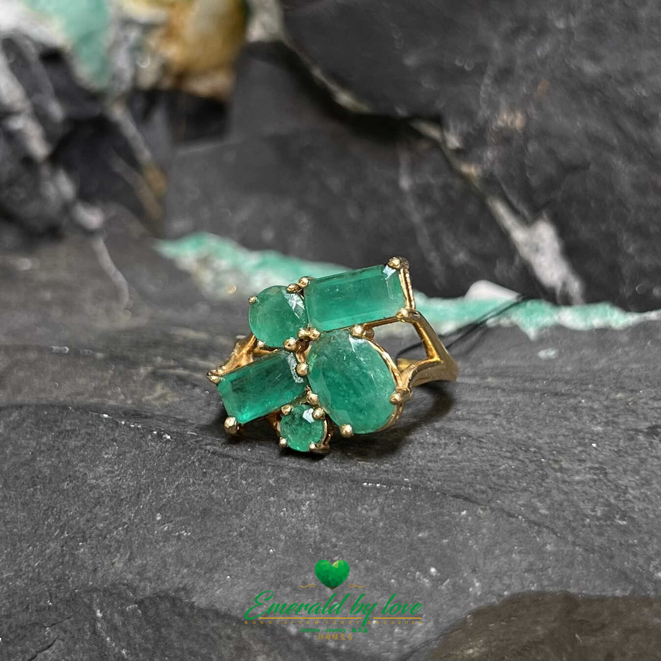 Vibrant Yellow Gold Crazy Ring: Assorted Emeralds for a Playful Statement