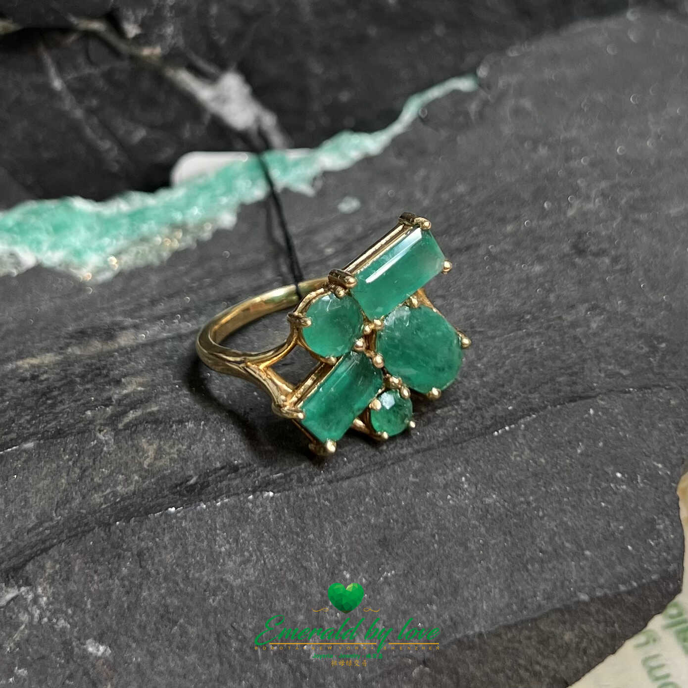 Vibrant Yellow Gold Crazy Ring: Assorted Emeralds for a Playful Statement
