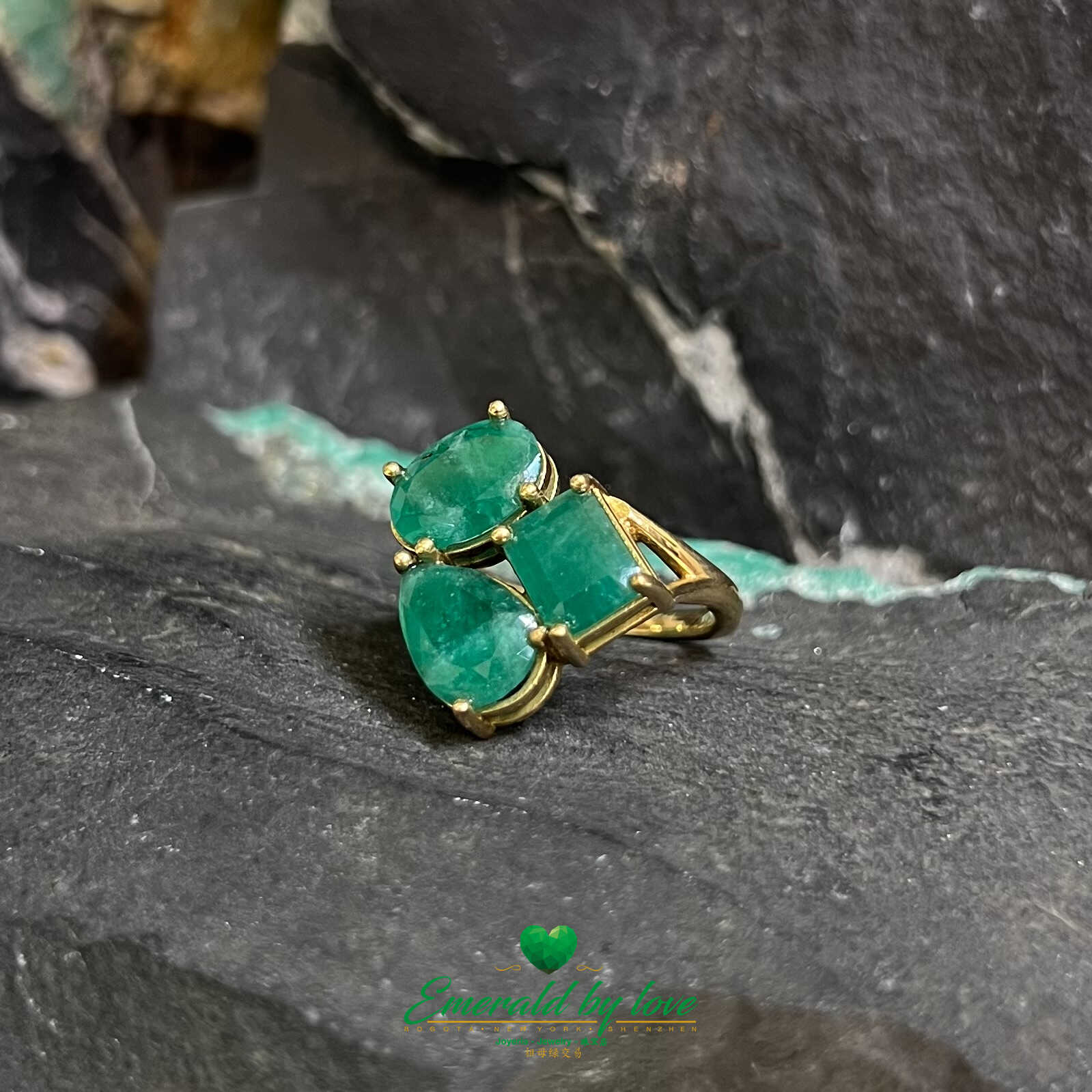 Trilogy of Elegance: Yellow Gold Ring with Three Colombian Emeralds